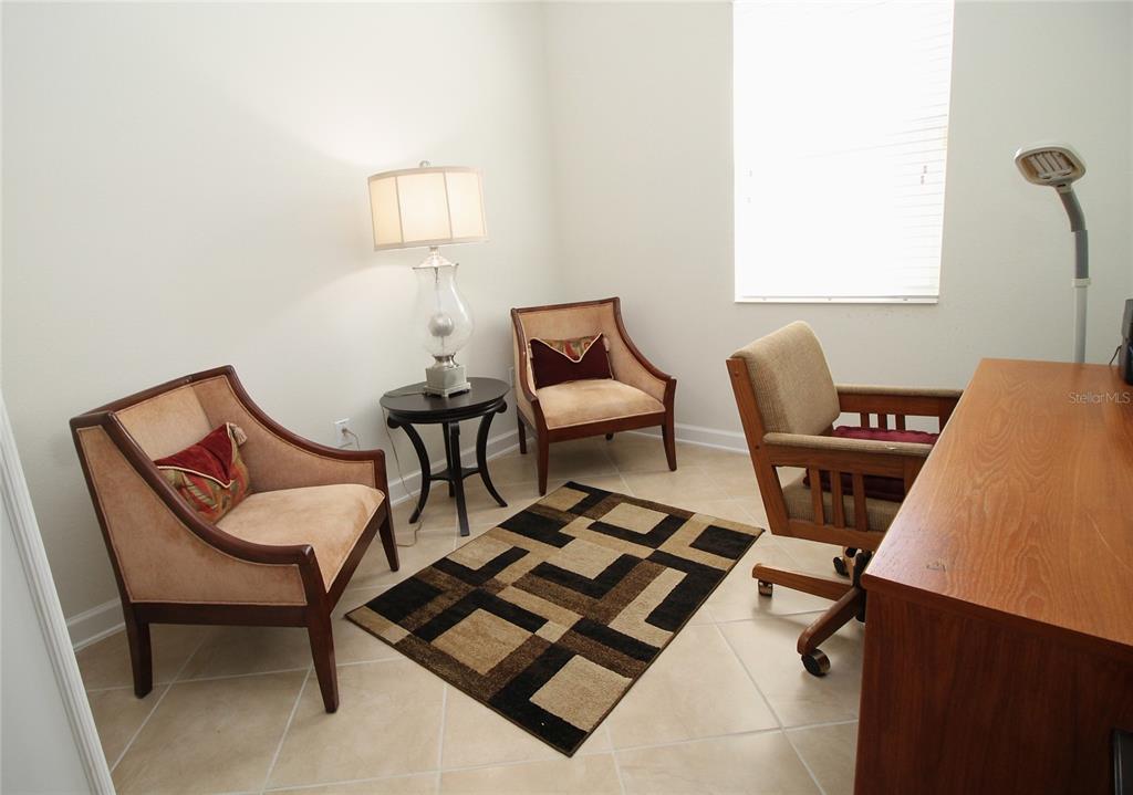3752 Quaint Lane Clermont, FL 34711 - Photo 12 of 49 a view of a workspace with furniture and a window