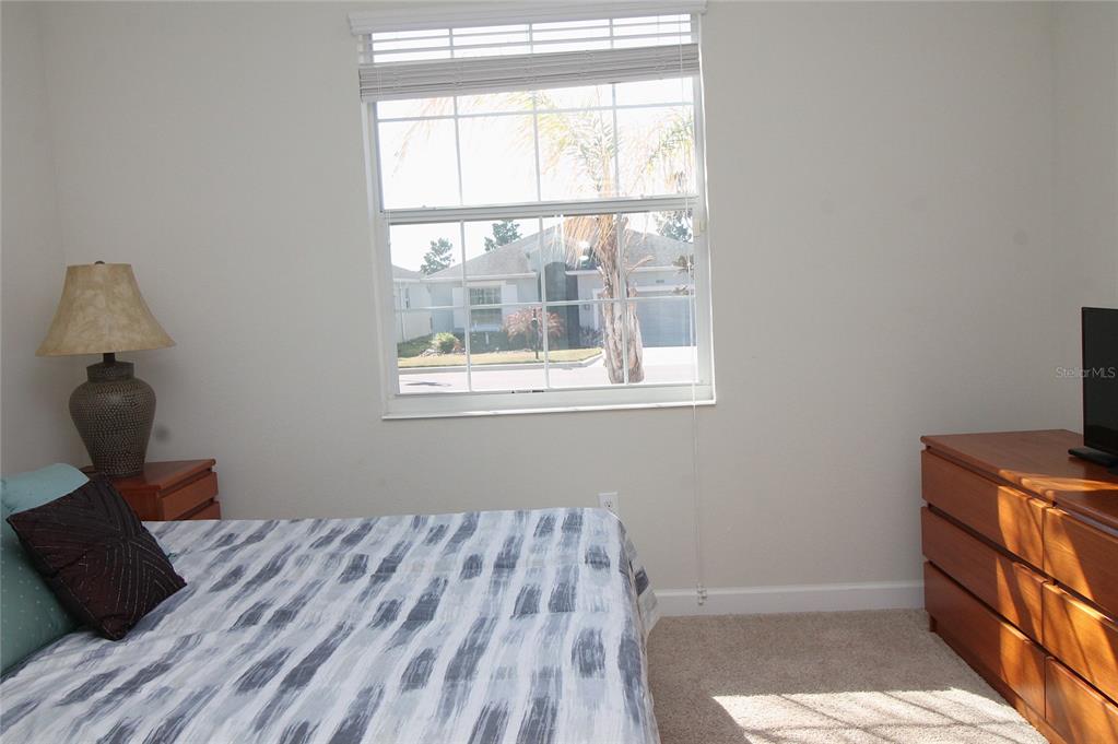 3752 Quaint Lane Clermont, FL 34711 - Photo 15 of 49 a bedroom with a bed and a window