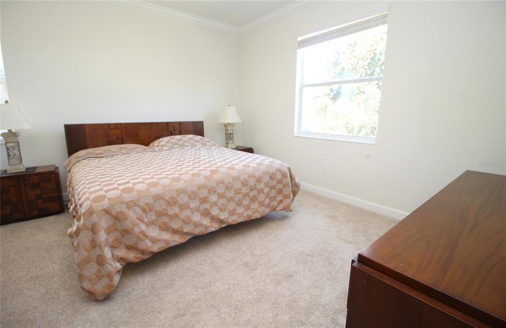 3752 Quaint Lane Clermont, FL 34711 - Photo 17 of 49 a bedroom with a bed and window
