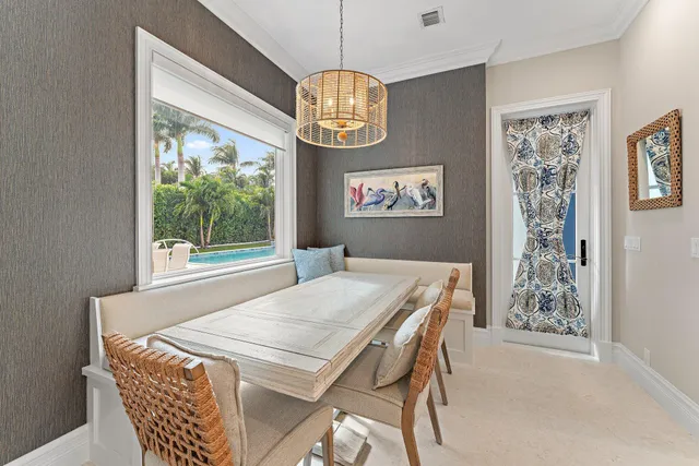 a view of a dining room with furniture window and outside view
