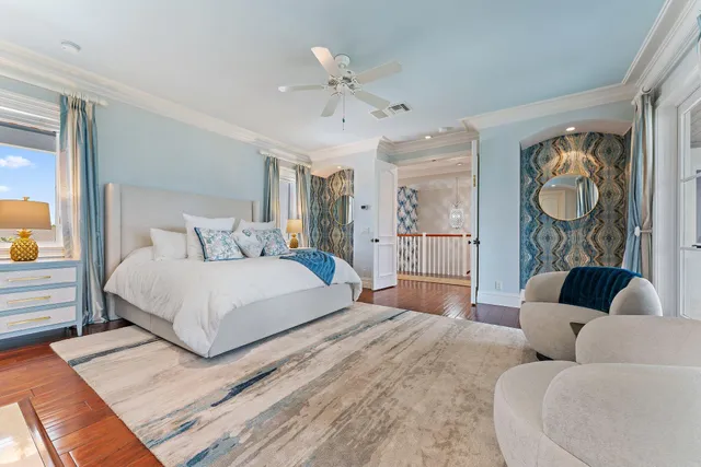 a bedroom with a large bed and a couch