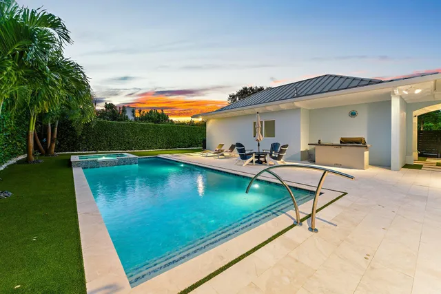 a view of swimming pool with outdoor seating