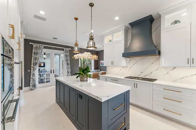 a kitchen with a sink stove and refrigerator