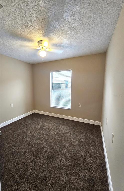 1025 Clovercrest Road Orlando, FL 32811 - Photo 12 of 27 an empty room with a empty space and a window