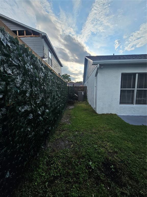 1025 Clovercrest Road Orlando, FL 32811 - Photo 23 of 27 a backyard of a house with lots of green space