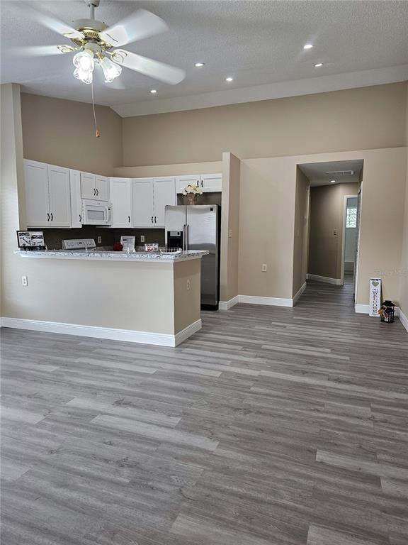 1025 Clovercrest Road Orlando, FL 32811 - Photo 6 of 27 a view of kitchen and kitchen with stainless steel appliances