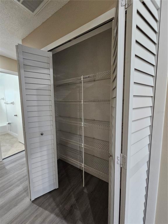 1025 Clovercrest Road Orlando, FL 32811 - Photo 10 of 27 a view of closet area with empty racks