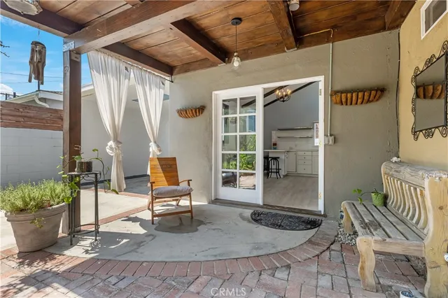 a living room with furniture and a kitchen