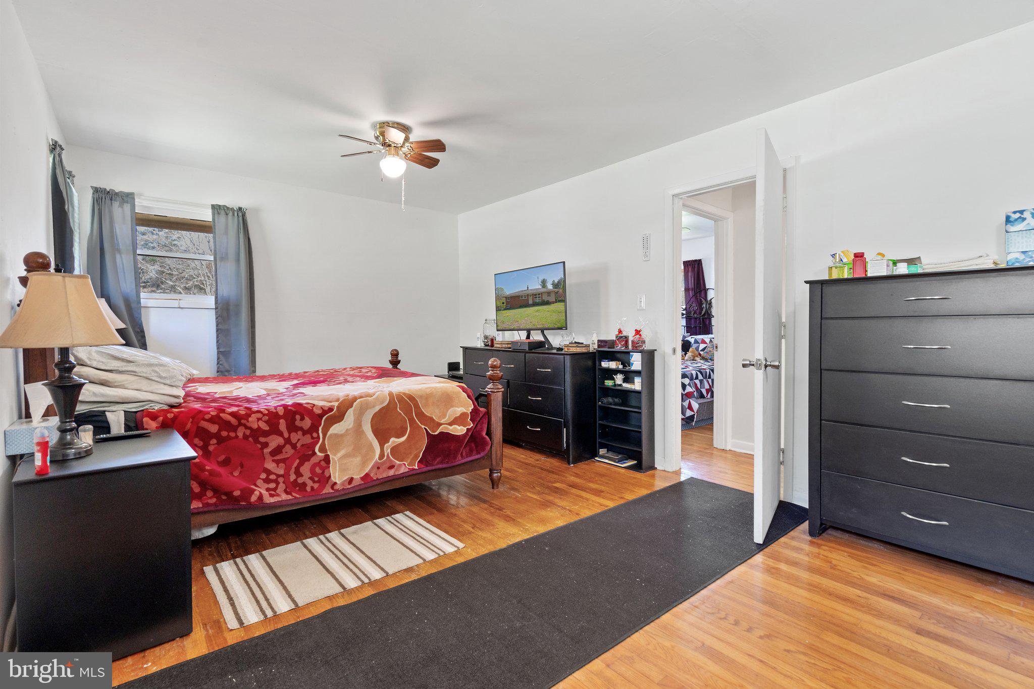 571 Richmond Road Amissville, VA 20106 - Photo 11 of 23 a bed room with a bed and dresser