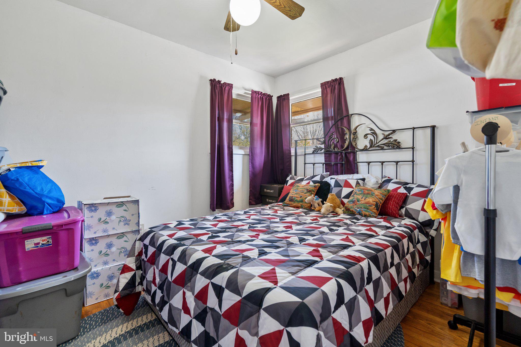 571 Richmond Road Amissville, VA 20106 - Photo 12 of 23 a bed sitting in a bedroom next to a window