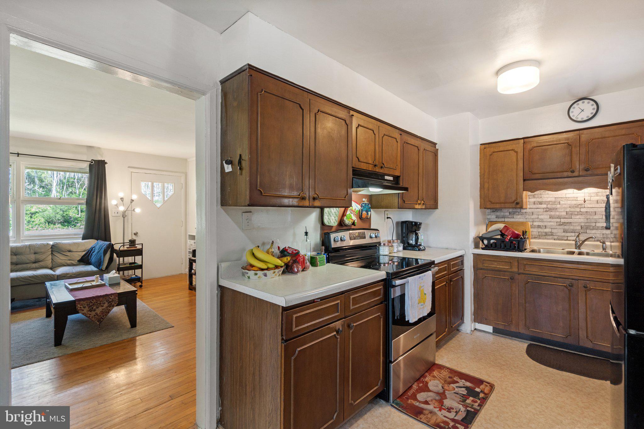 571 Richmond Road Amissville, VA 20106 - Photo 6 of 23 a kitchen with stainless steel appliances granite countertop a stove top oven a sink dishwasher and cabinets with wooden floor