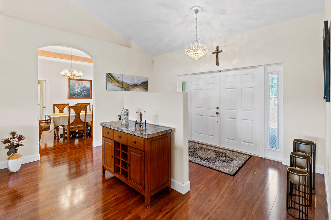 2774 Gentile Road Fort Pierce, FL 34945 - Photo 13 of 70 a very nice looking room with wooden floor and furniture