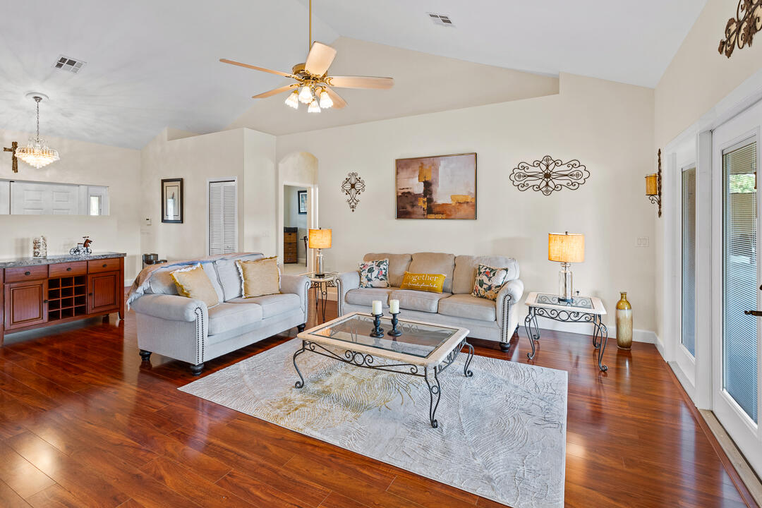 2774 Gentile Road Fort Pierce, FL 34945 - Photo 16 of 70 a living room with furniture and wooden floor