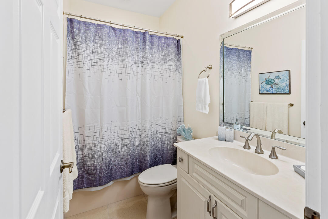 2774 Gentile Road Fort Pierce, FL 34945 - Photo 26 of 70 a bathroom with a sink toilet and shower