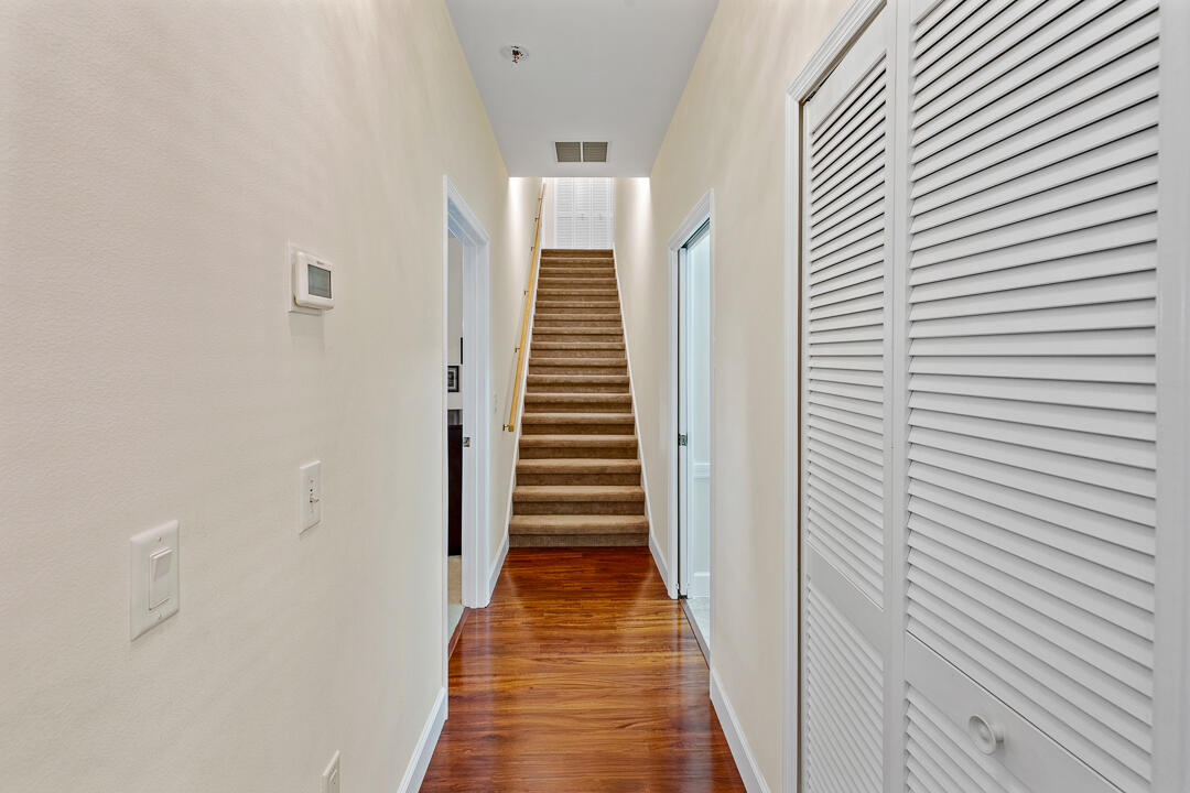 2774 Gentile Road Fort Pierce, FL 34945 - Photo 28 of 70 a view of a hallway with wooden floor