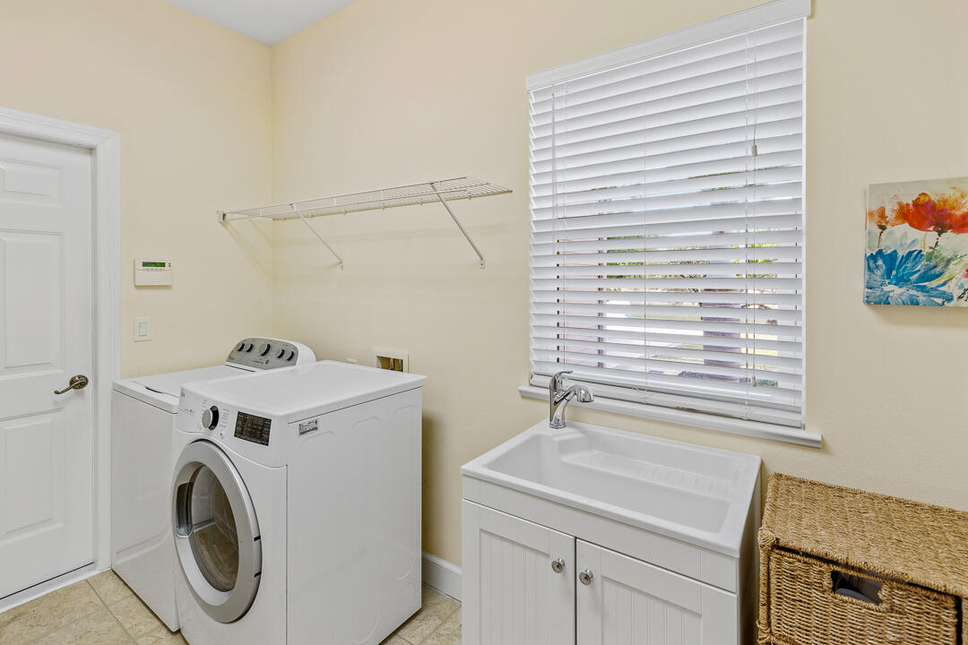2774 Gentile Road Fort Pierce, FL 34945 - Photo 30 of 70 a utility room with dryer and washer