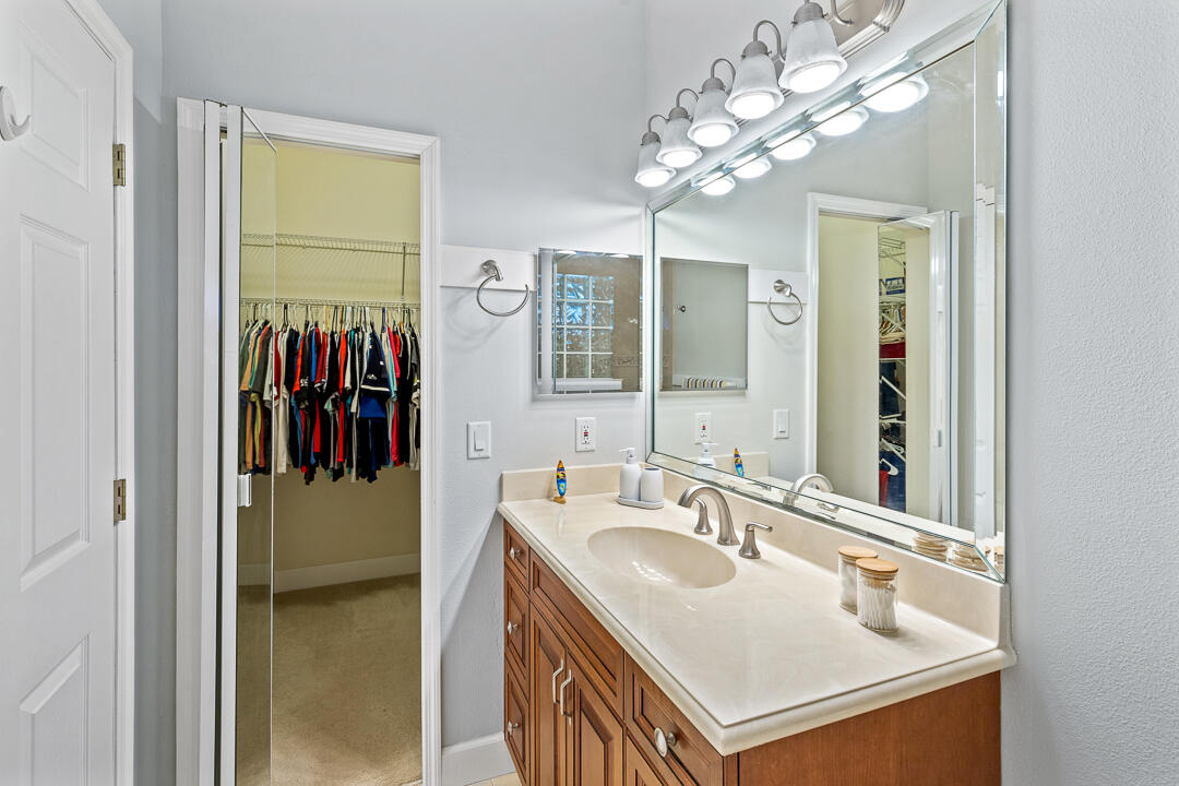 2774 Gentile Road Fort Pierce, FL 34945 - Photo 33 of 70 a bathroom with a sink vanity and a mirror