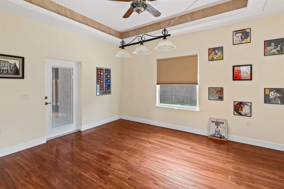 2774 Gentile Road Fort Pierce, FL 34945 - Photo 36 of 70 a view of empty room with wooden floor and fan