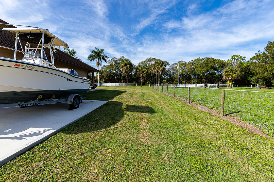 2774 Gentile Road Fort Pierce, FL 34945 - Photo 52 of 70 a view of a backyard with swimming pool