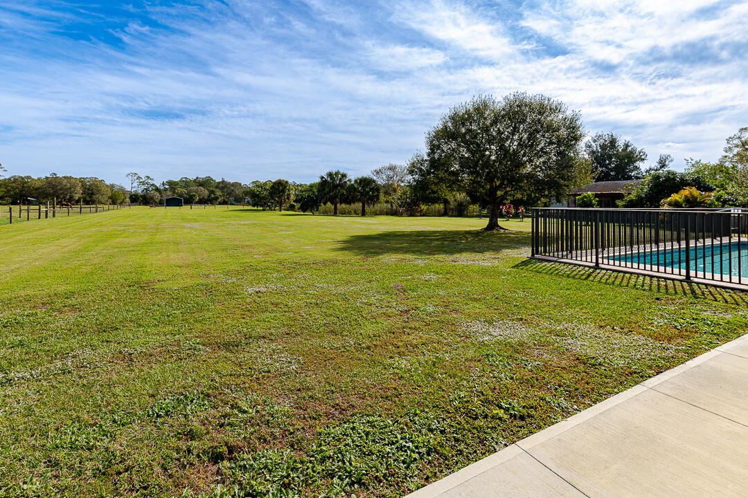 2774 Gentile Road Fort Pierce, FL 34945 - Photo 54 of 70 a view of a lake from a yard