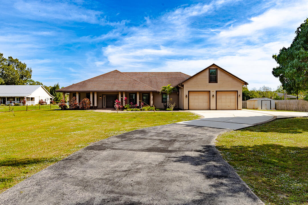 2774 Gentile Road Fort Pierce, FL 34945 - Photo 58 of 70 a view of a house with swimming pool and porch