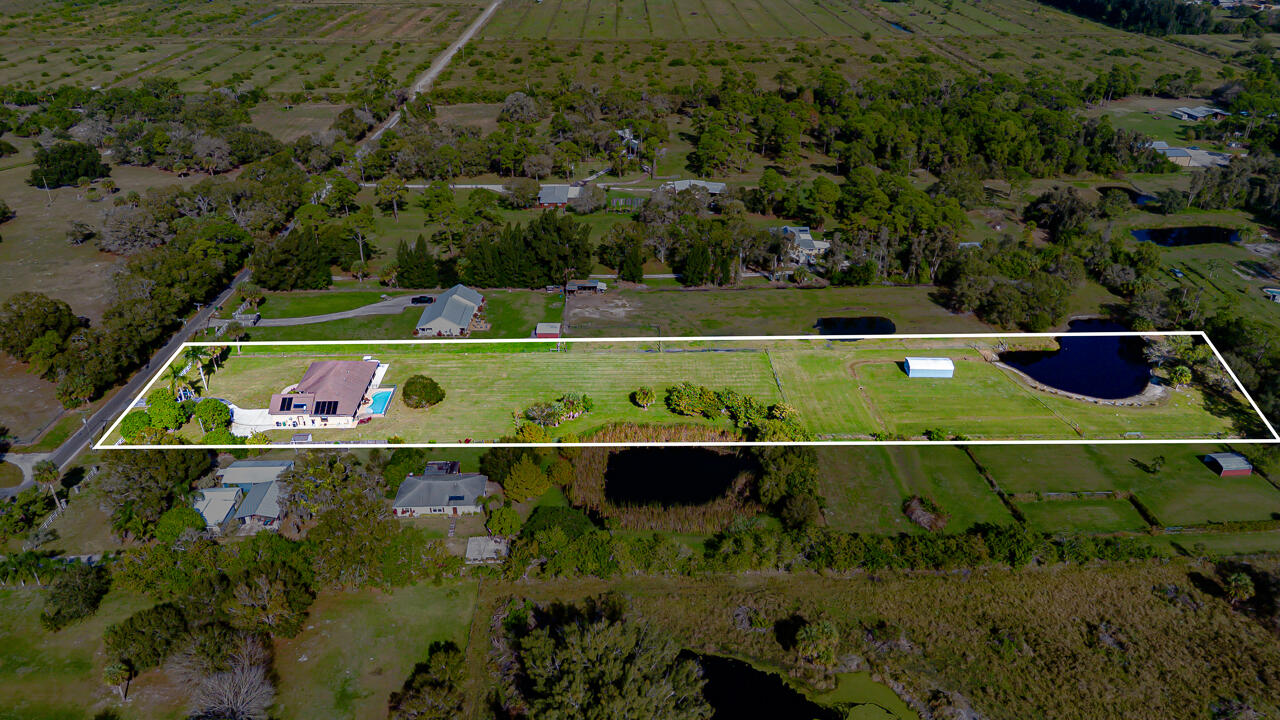 2774 Gentile Road Fort Pierce, FL 34945 - Photo 6 of 70 an aerial view of a and a yard