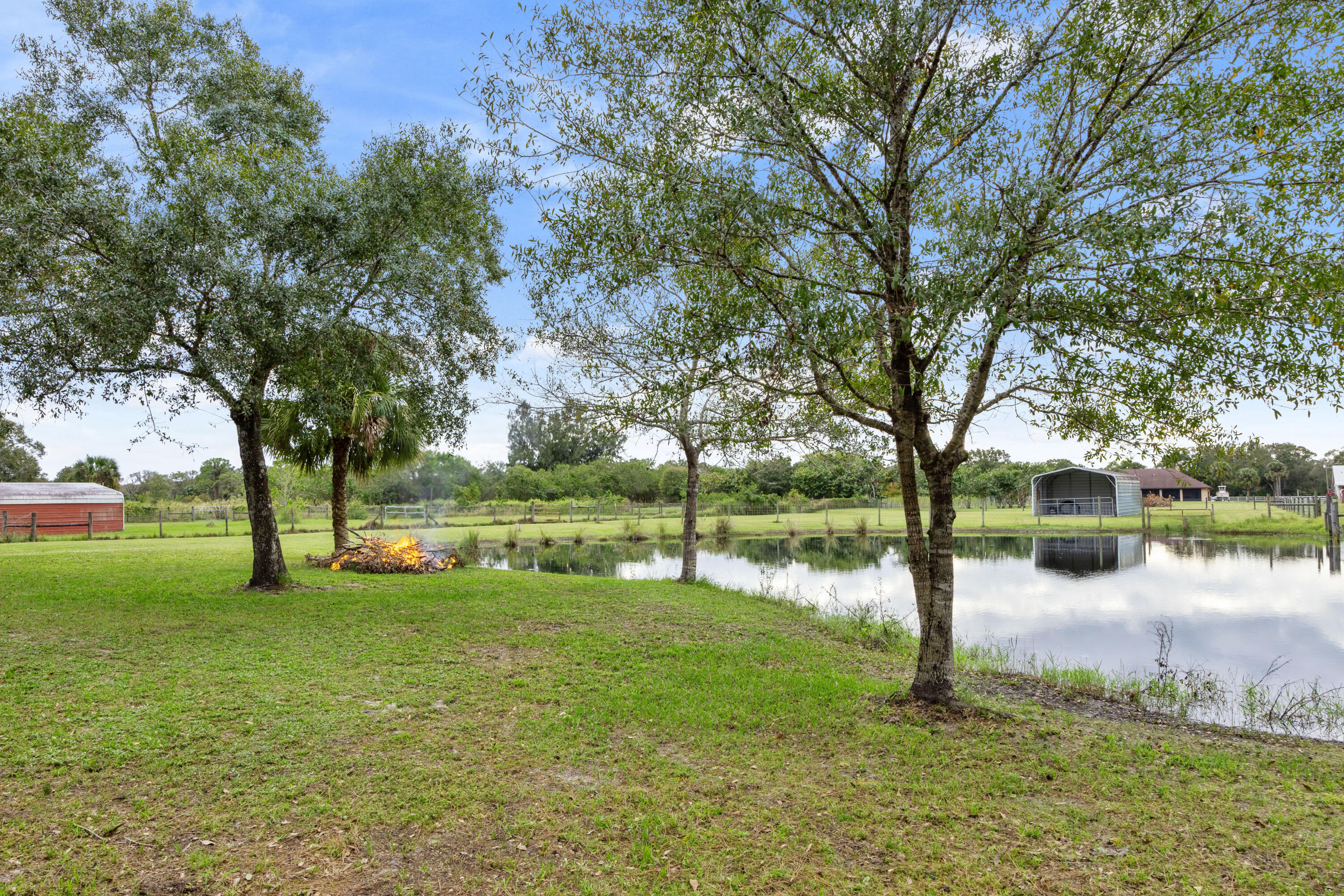 2774 Gentile Road Fort Pierce, FL 34945 - Photo 64 of 70 a backyard of a house with lots of green space
