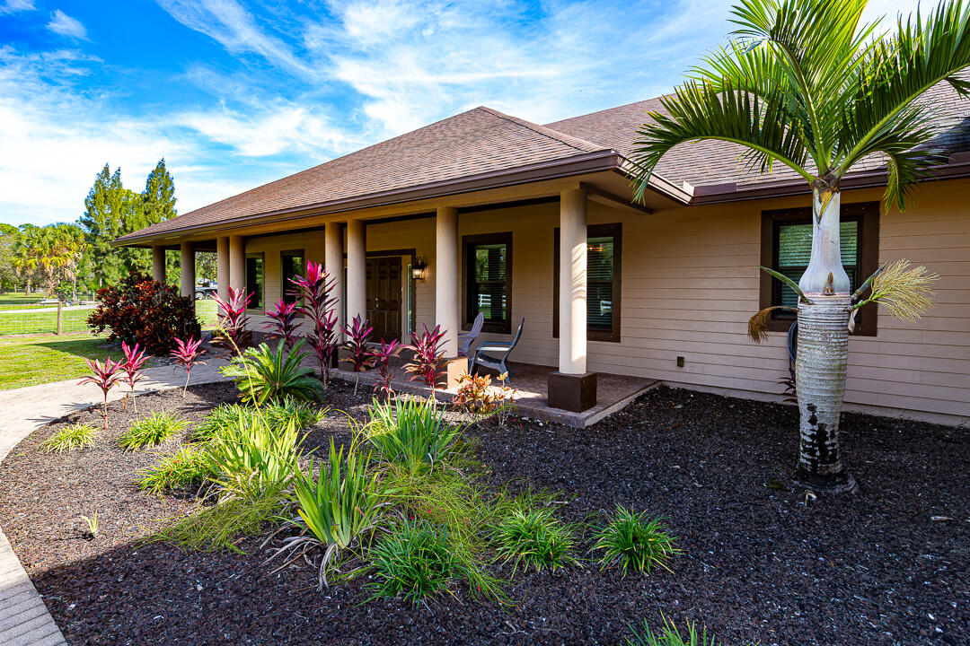 2774 Gentile Road Fort Pierce, FL 34945 - Photo 10 of 70 a view of a house with a backyard and porch
