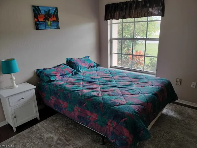 a utility room with cabinets washer and dryer