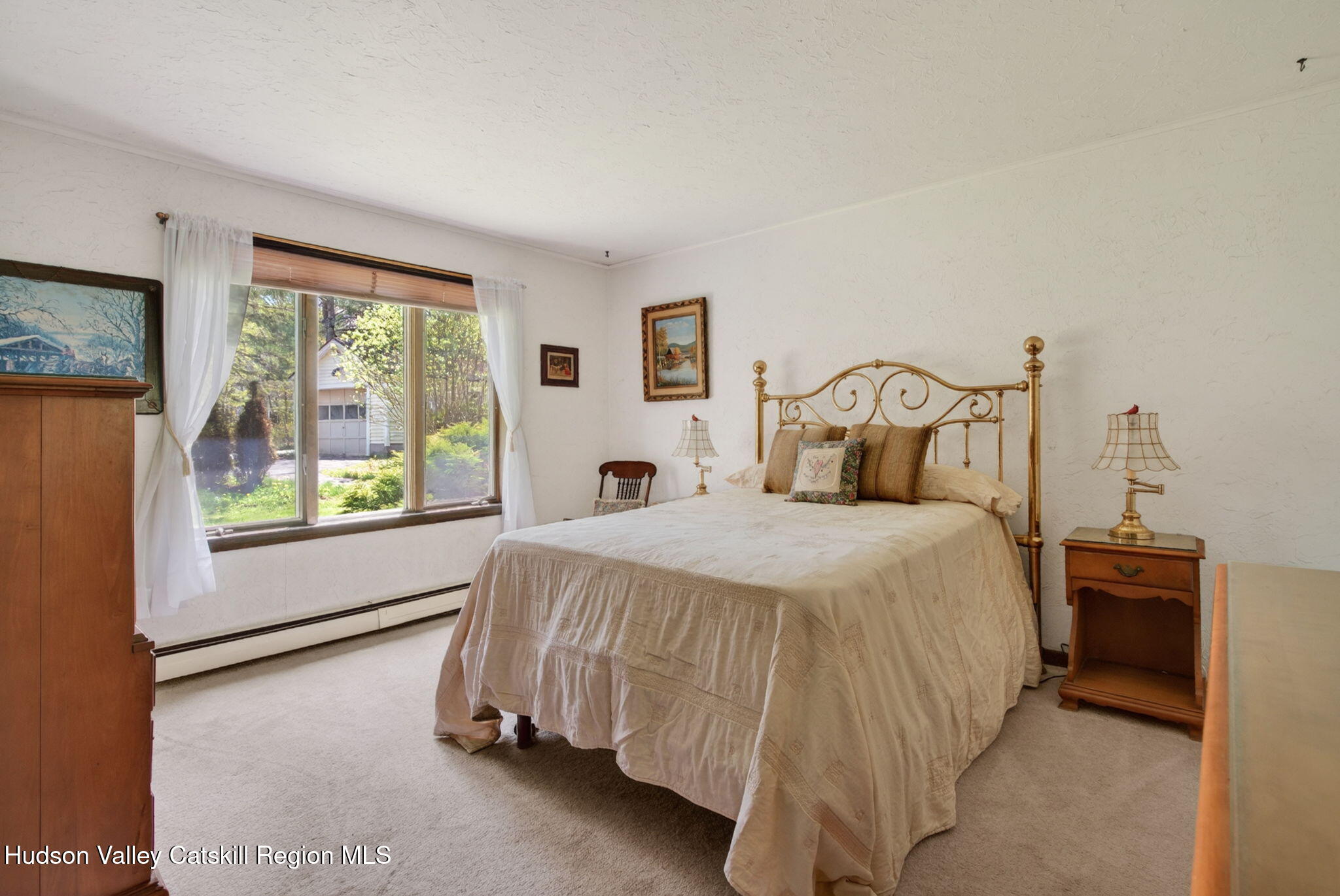 689 Old Road Windham, NY 12496 - Photo 14 of 42 a bedroom with a bed and a window
