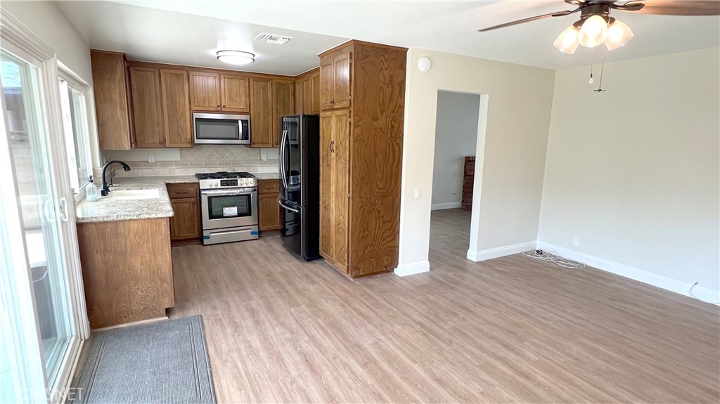 5708 Damon Street Simi Valley, CA 93063 - Photo 11 of 23 a kitchen with stainless steel appliances a refrigerator stove and sink