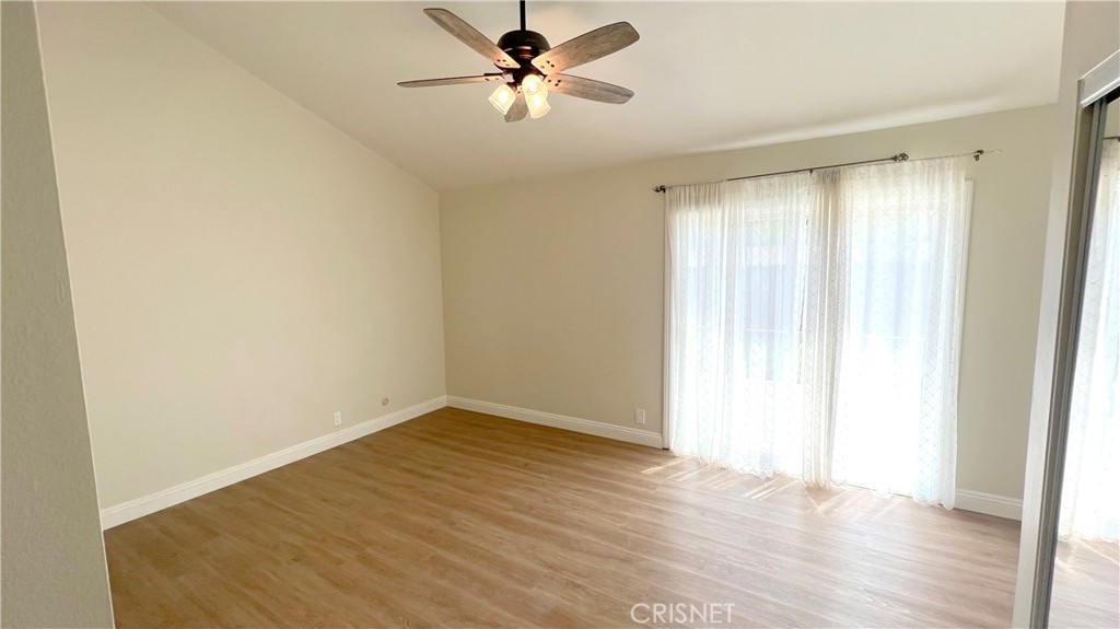5708 Damon Street Simi Valley, CA 93063 - Photo 12 of 23 a view of a room with wooden floor and a ceiling fan