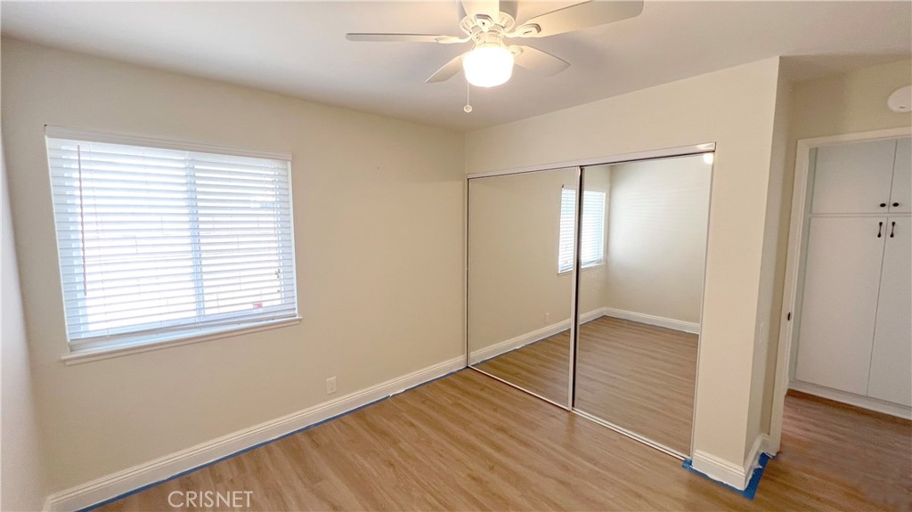 5708 Damon Street Simi Valley, CA 93063 - Photo 15 of 23 a view of an empty room with wooden floor and a window