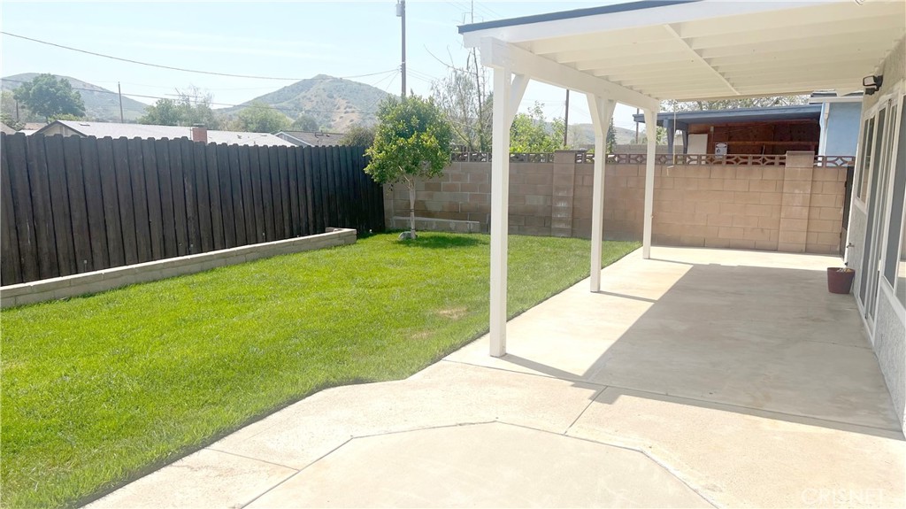 5708 Damon Street Simi Valley, CA 93063 - Photo 20 of 23 a backyard of a house with plants and wooden fence
