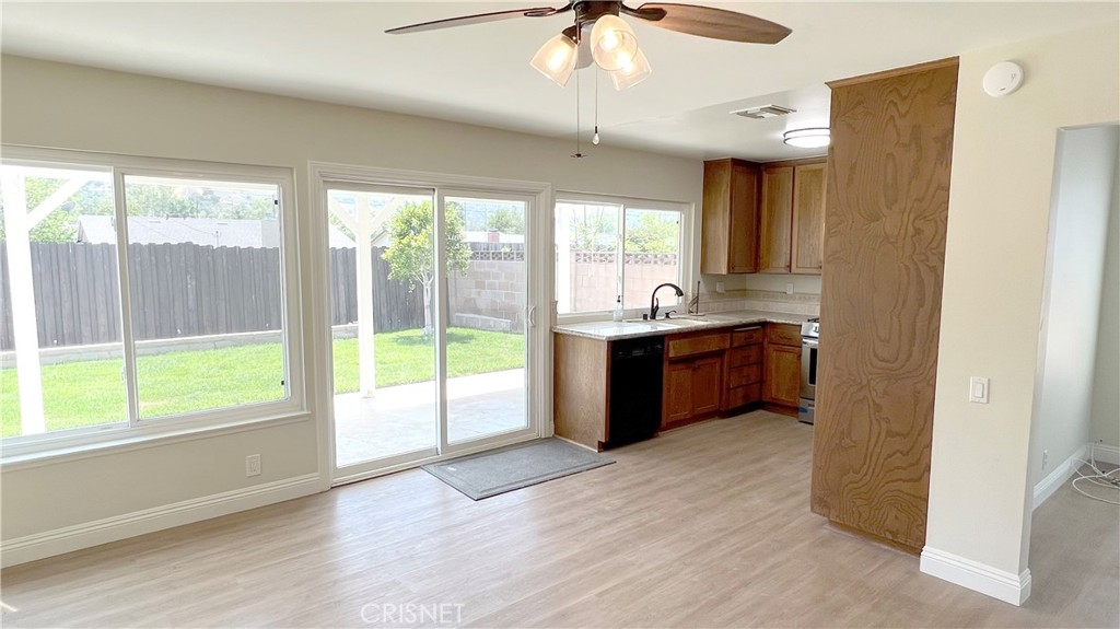 5708 Damon Street Simi Valley, CA 93063 - Photo 8 of 23 a kitchen with stainless steel appliances a sink and a large window