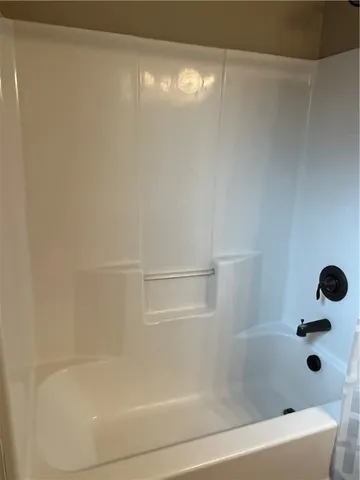 a bathroom with a shower and a bathtub
