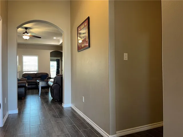a view of a livingroom and dining room with wooden floor