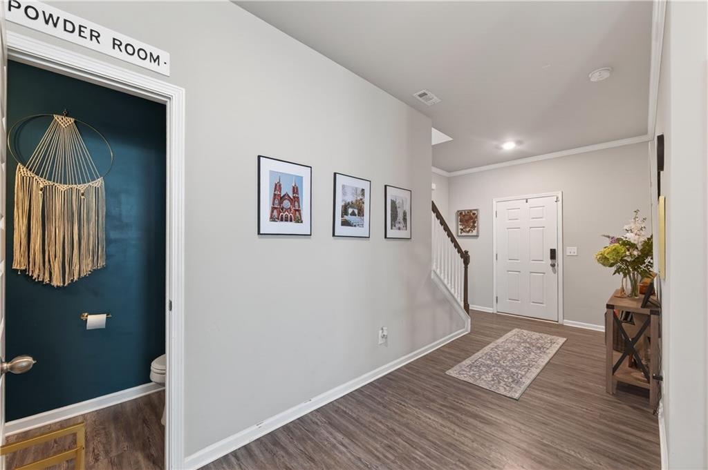 266 Shoals Bridge Road Acworth, GA 30102 - Photo 7 of 43 a view of an entryway with wooden floor and stairs