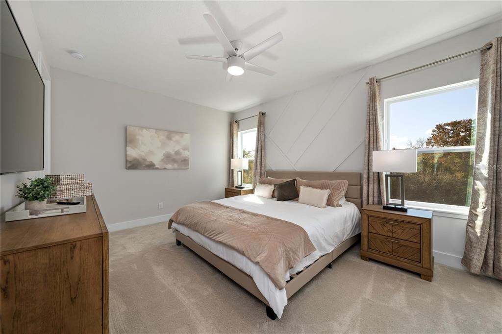 7834 Spectrum Drive Reunion, FL 34747 - Photo 8 of 16 a bedroom with a bed table and window