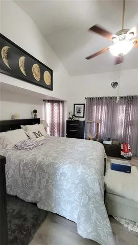 a bedroom with a bed and window