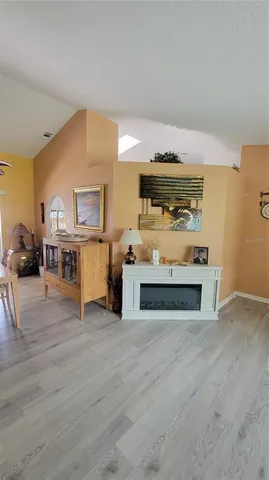 a view of kitchen with furniture and wooden floor