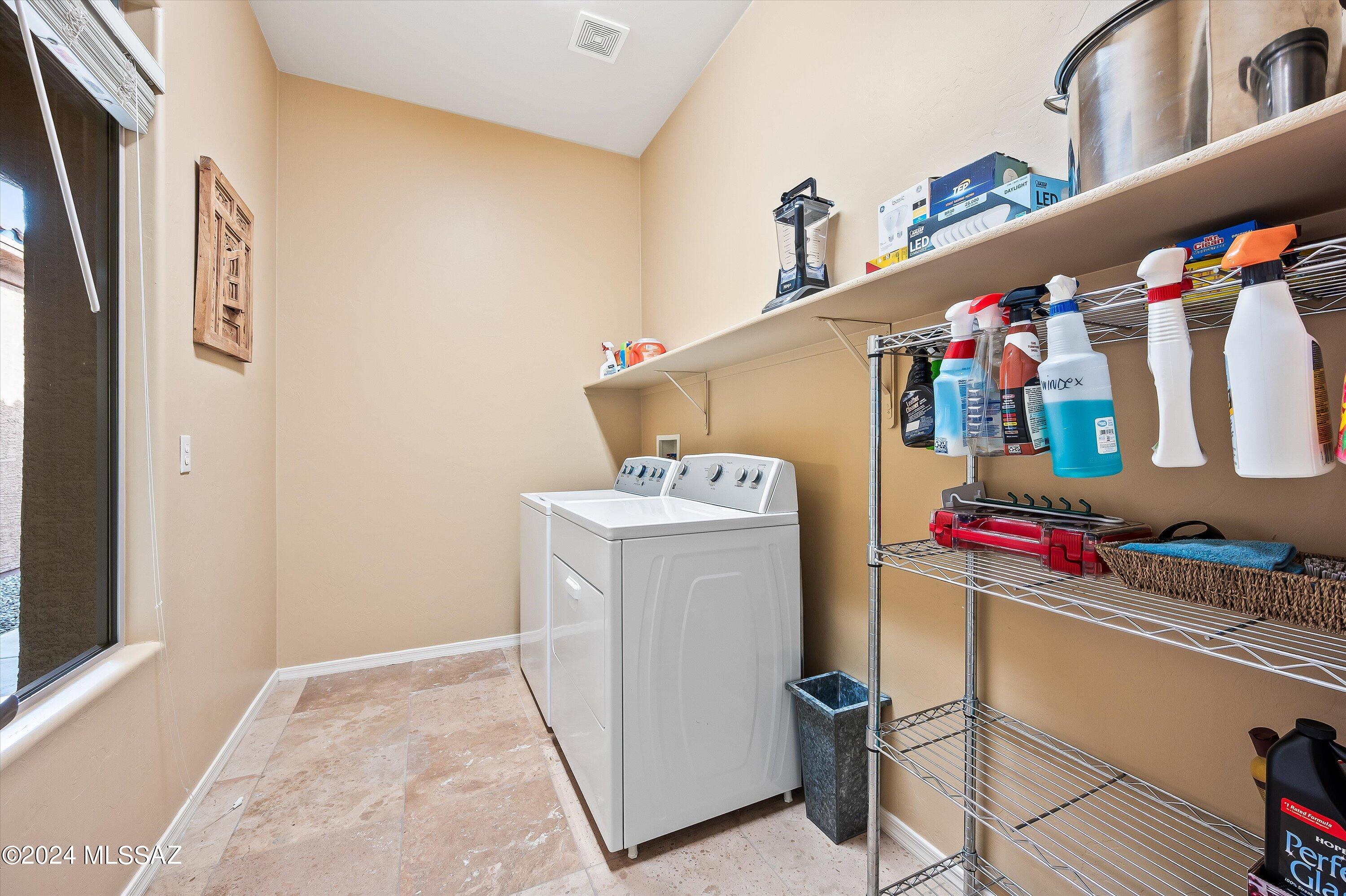 8579 North Shadow Wash Way Tucson, AZ 85743 - Photo 27 of 34 a utility room with dryer and washer