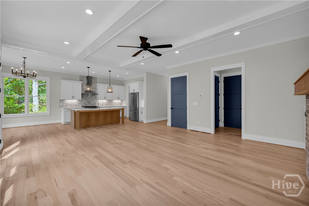 2476 St Martin Way Monroe, GA 30656 - Photo 11 of 75 Spacious interior featuring wood-finish flooring, a tray ceiling, and recessed lighting