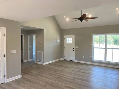 122 Pisgah Ridge Road Pulaski, TN 38478 - Photo 3 of 16 a view of an empty room with wooden floor and a window