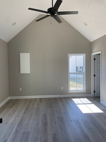 122 Pisgah Ridge Road Pulaski, TN 38478 - Photo 7 of 16 an empty room with wooden floor and windows