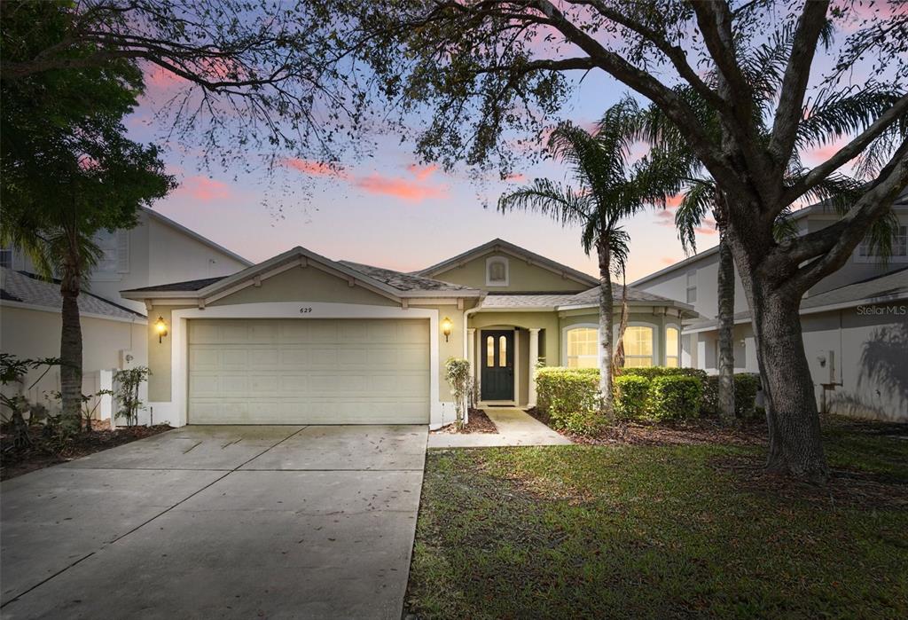 front view of a house with a yard