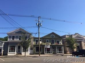 379 Whitfield Street, Unit AN236 Guilford, CT 06437 - Photo 30 of 31 a front view of a building with a ceiling fan