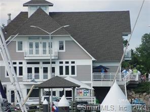 379 Whitfield Street, Unit AN236 Guilford, CT 06437 - Photo 10 of 31 a front view of a house with a yard