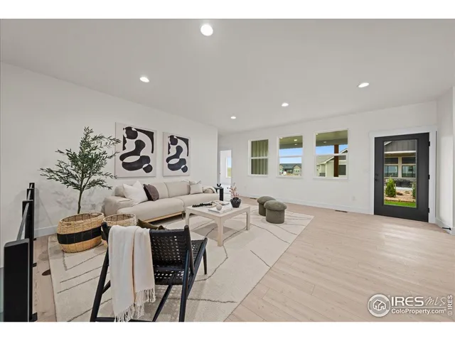a living room with furniture and window