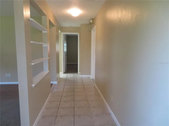 a view of hallway with a window